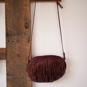 Bloomingdales Italian Leather with fringe shoulder bag with a thin strap